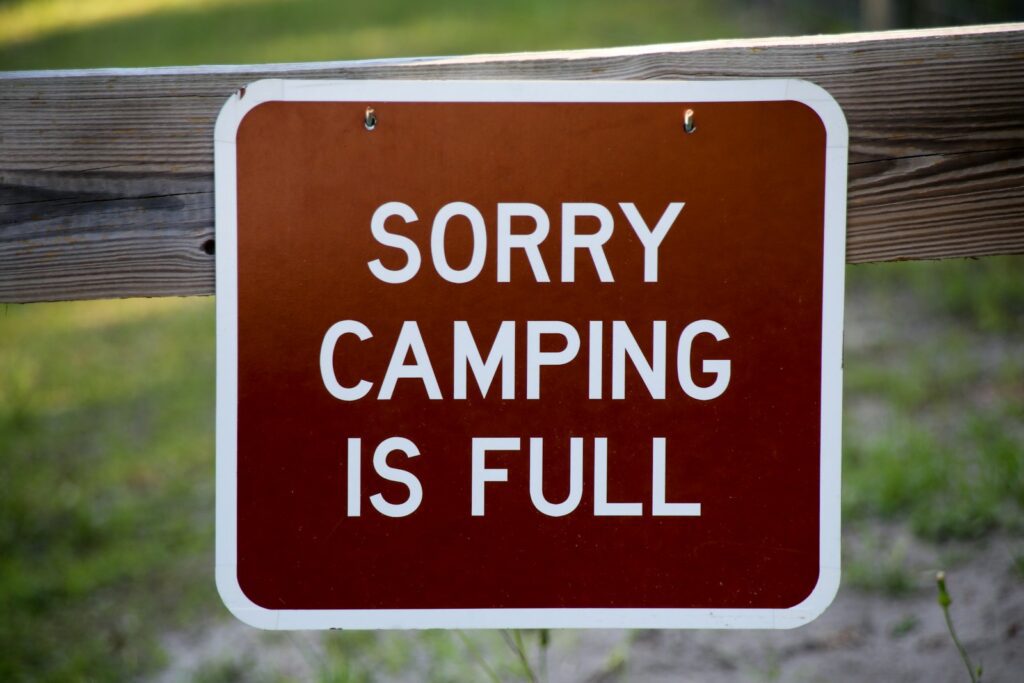 red and white no camping sign